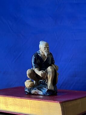 Blue and Cream Ceramic Elder Figurine Accent - Unbranded